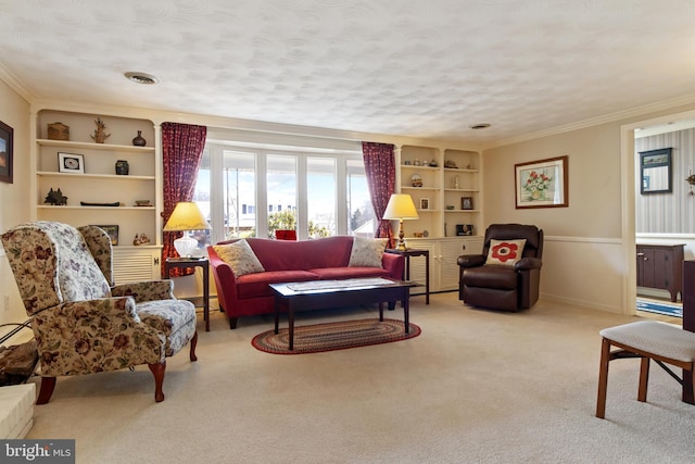 living area featuring a textured ceiling, built in shelves, a baseboard heating unit, carpet floors, and crown molding