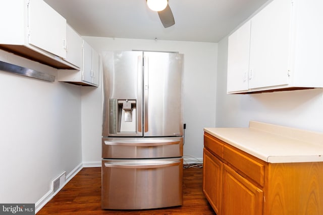 kitchen featuring stainless steel fridge, white cabinets, dark wood-style floors, ceiling fan, and light countertops