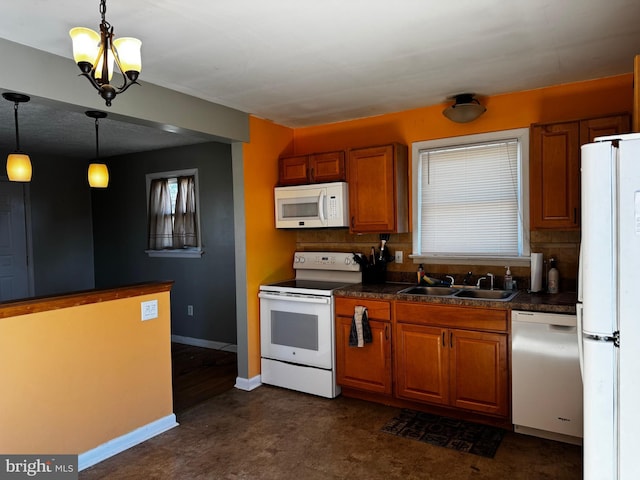 kitchen with a sink, white appliances, tasteful backsplash, and brown cabinets