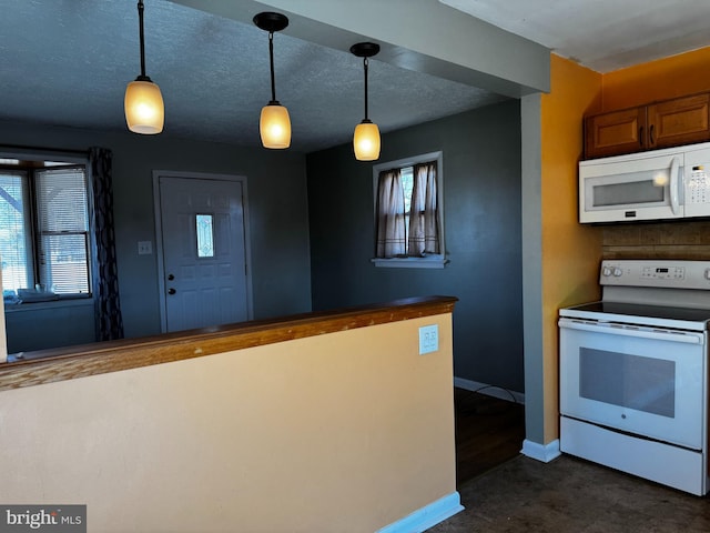 kitchen with white appliances, decorative light fixtures, and a textured ceiling