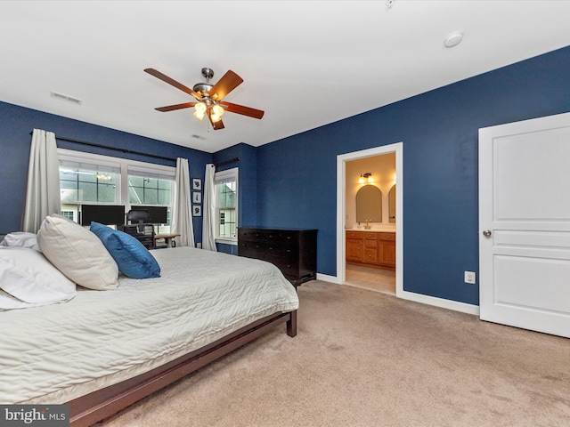 bedroom featuring baseboards, visible vents, arched walkways, connected bathroom, and carpet floors