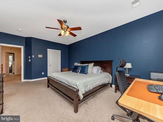 carpeted bedroom with ceiling fan, visible vents, and baseboards