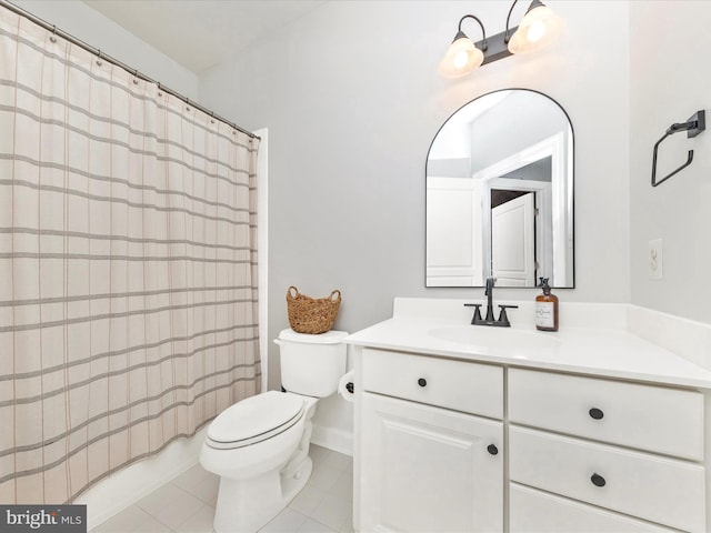 full bath featuring vanity, toilet, and tile patterned floors