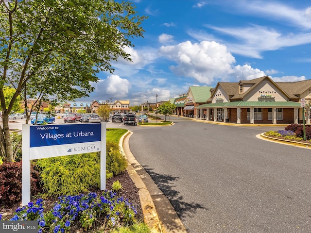 view of road with curbs and a residential view