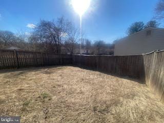 view of yard with a fenced backyard