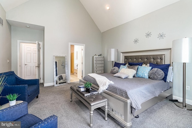 carpeted bedroom with ensuite bath, visible vents, high vaulted ceiling, and baseboards