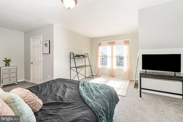 bedroom featuring baseboards and carpet flooring