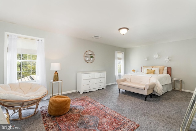 bedroom with carpet flooring, baseboards, and visible vents