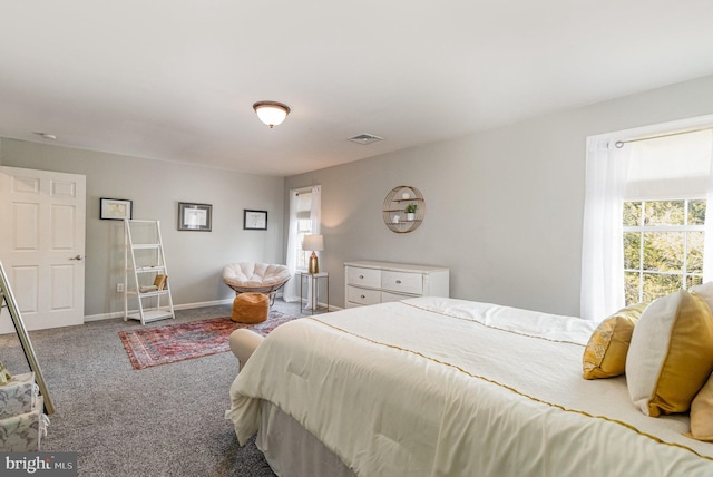 carpeted bedroom with visible vents and baseboards