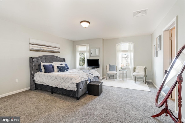 bedroom with visible vents, baseboards, and carpet floors