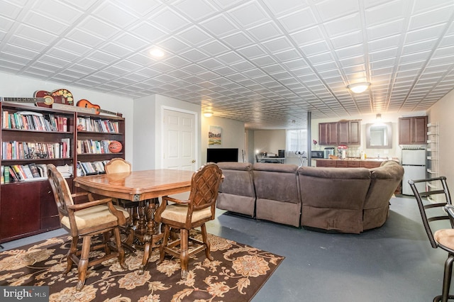 dining area with concrete flooring