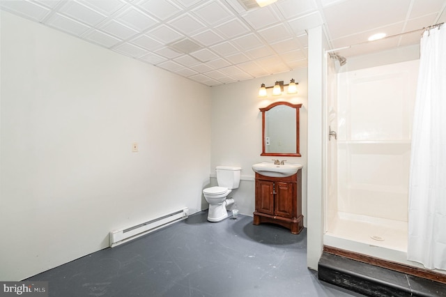 full bathroom with vanity, a shower stall, toilet, and a baseboard radiator