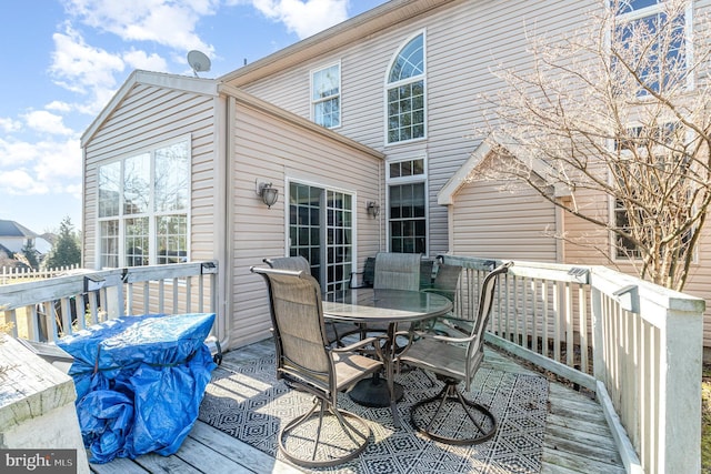 deck with outdoor dining space