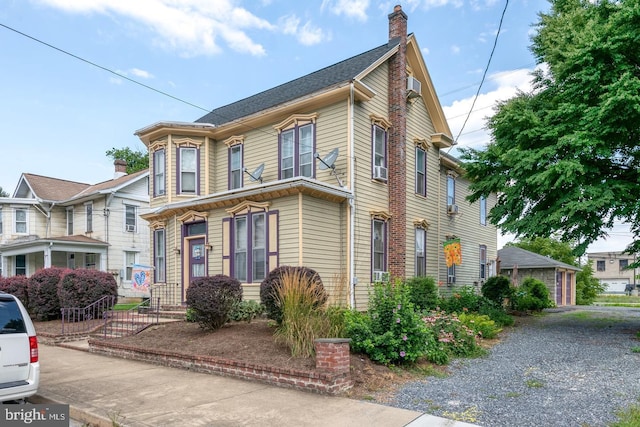 view of front of home featuring a chimney