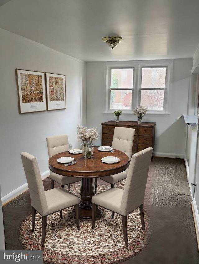 dining room featuring baseboards