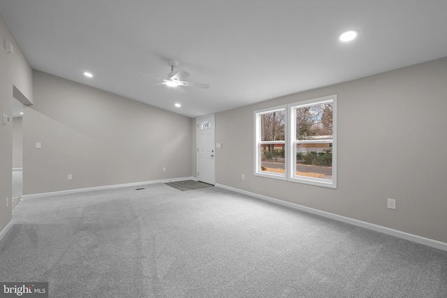 carpeted spare room featuring recessed lighting, ceiling fan, and baseboards