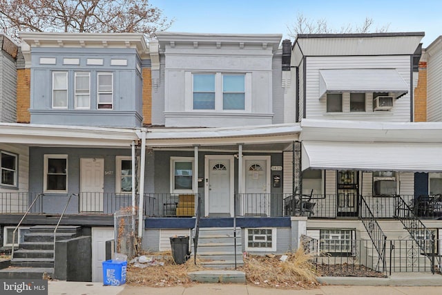 townhome / multi-family property with covered porch