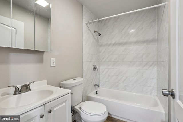 bathroom featuring vanity, shower / bathtub combination, and toilet