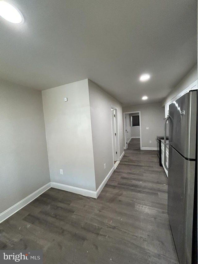 interior space with recessed lighting, baseboards, and dark wood-style flooring