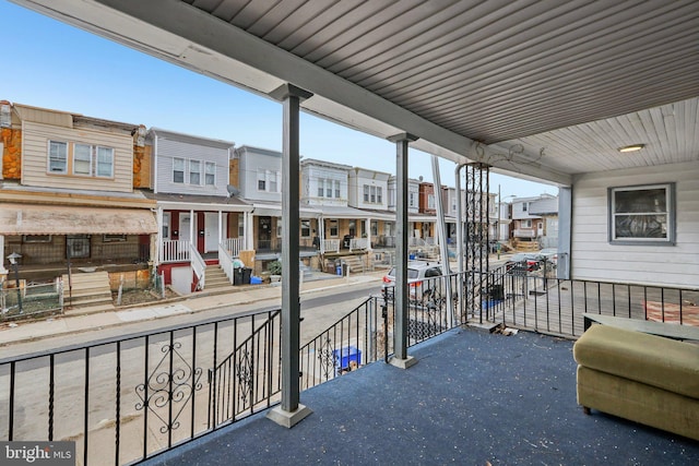 balcony featuring a residential view