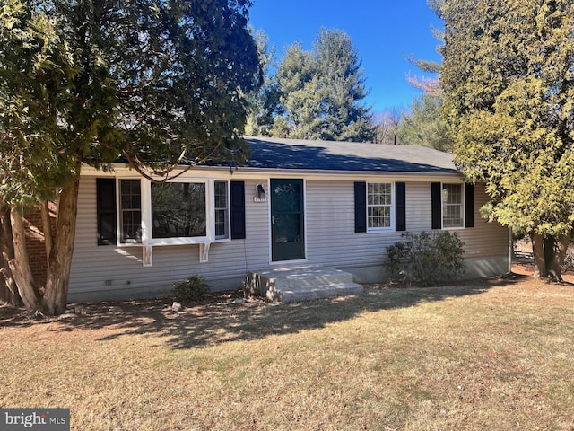 ranch-style house with a front lawn