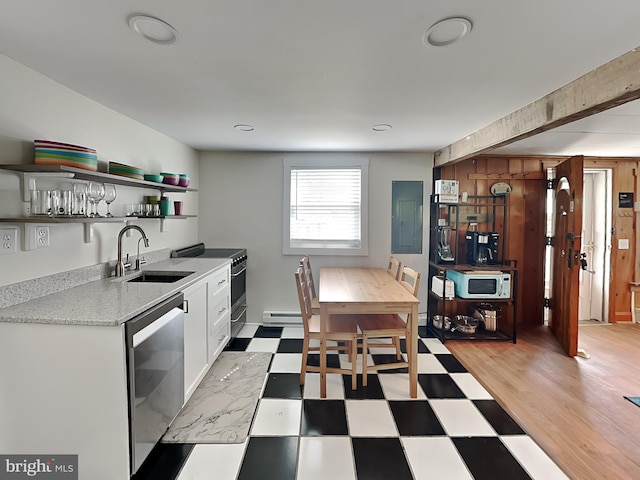 kitchen featuring open shelves, light floors, appliances with stainless steel finishes, white cabinetry, and a sink