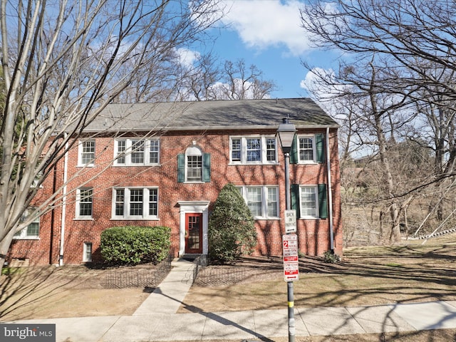 view of front of home with brick siding