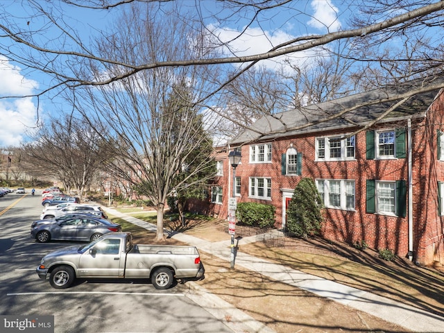 view of front of home featuring brick siding