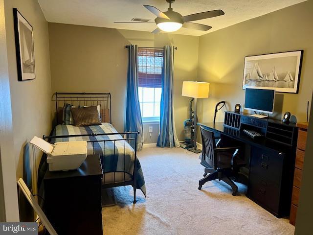 bedroom featuring carpet flooring, a ceiling fan, and baseboards