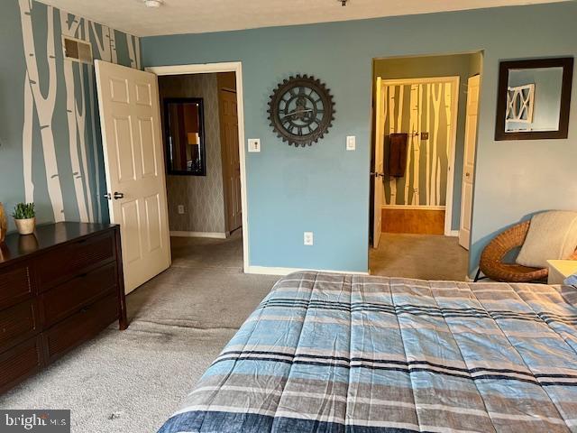 bedroom with carpet flooring and baseboards