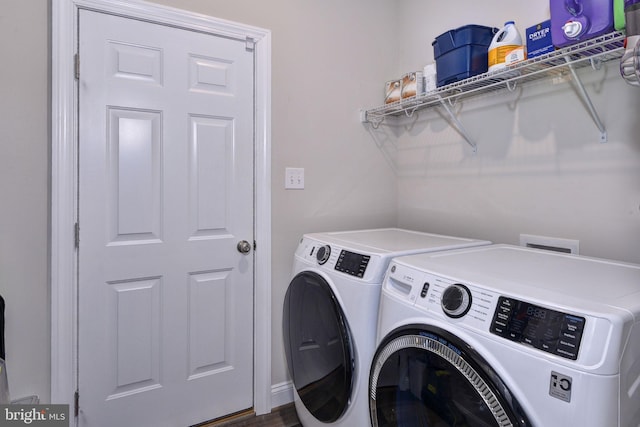 clothes washing area with laundry area and washer and clothes dryer