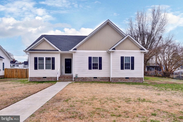 view of front of home featuring crawl space, a front lawn, and fence