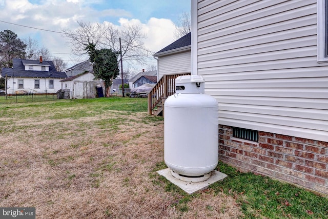 exterior details featuring heating fuel and fence