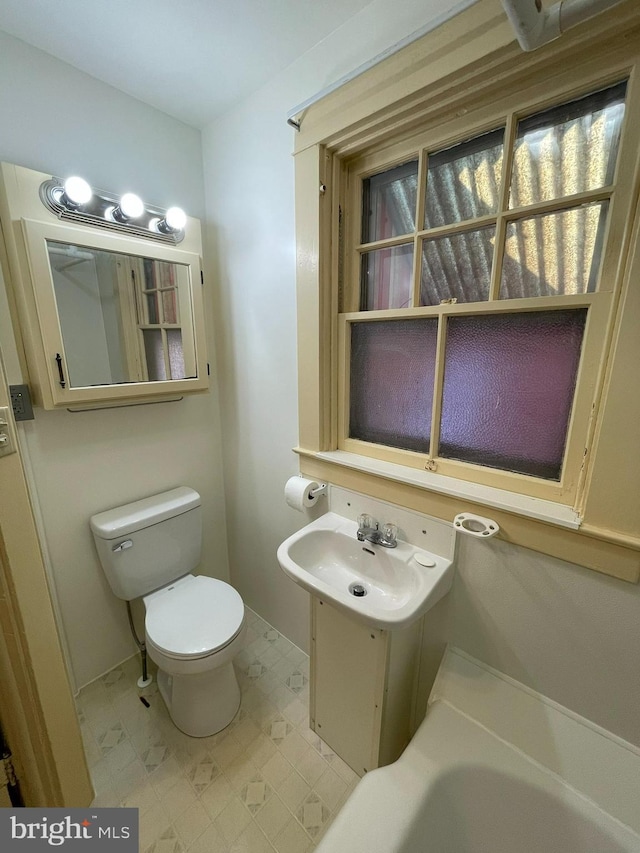 bathroom featuring a sink and toilet