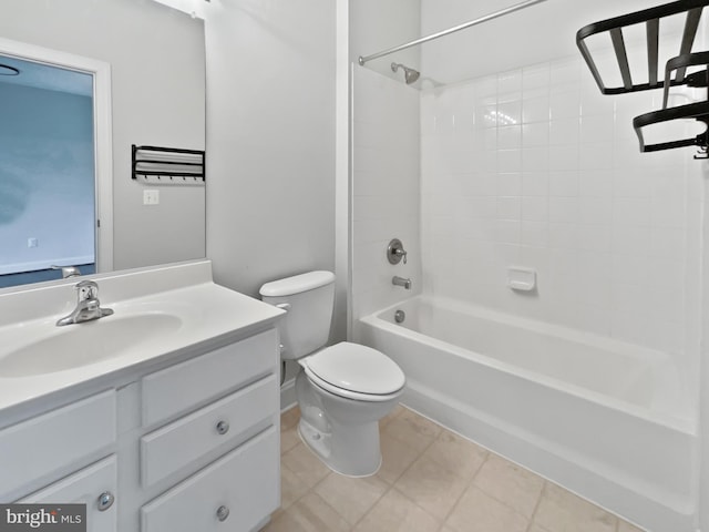 full bath featuring tile patterned flooring, shower / bath combination, vanity, and toilet