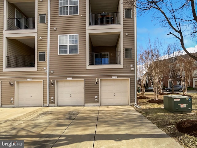 exterior space featuring driveway and an attached garage