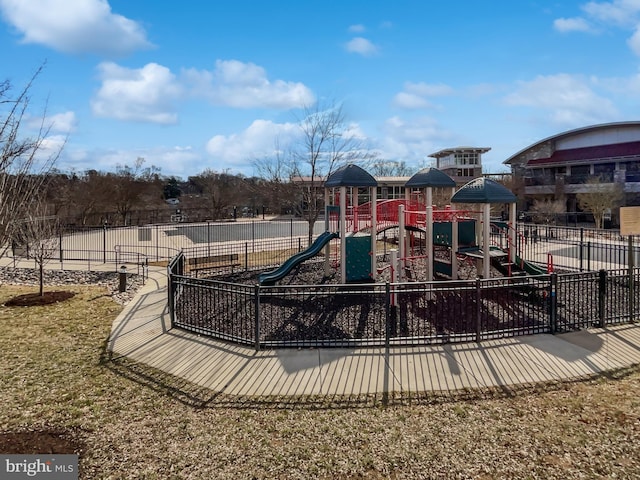 community jungle gym featuring fence