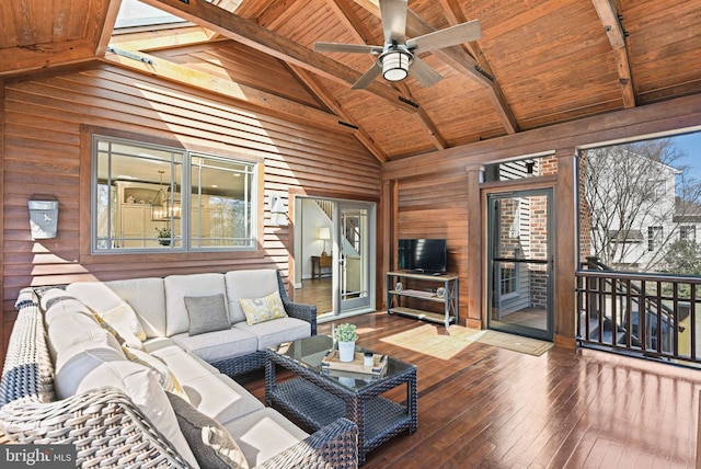 living room featuring hardwood / wood-style floors, beamed ceiling, wooden walls, and wooden ceiling