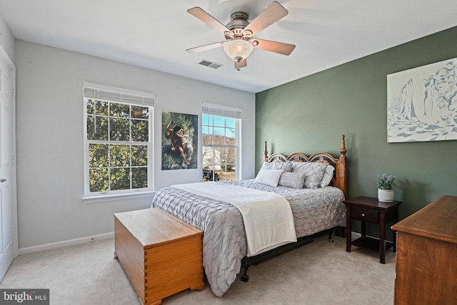 bedroom with visible vents, ceiling fan, baseboards, and carpet