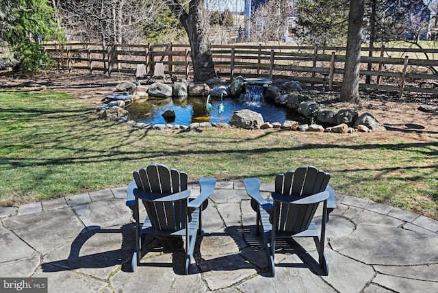 view of yard featuring fence and a patio area