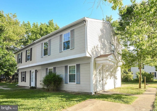 colonial home with a front yard