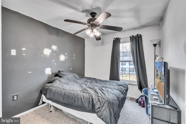 bedroom with carpet, baseboards, and ceiling fan