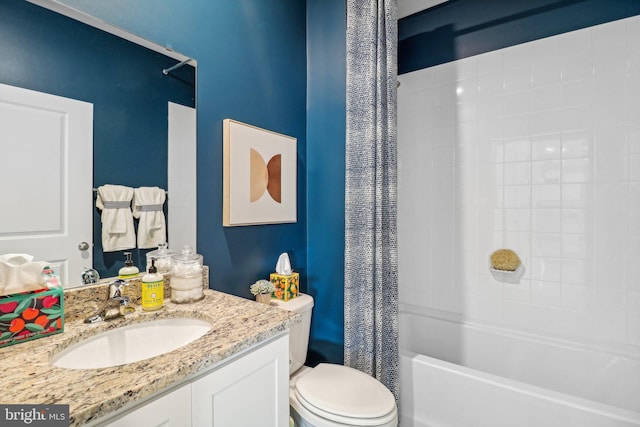 full bathroom featuring toilet, vanity, and shower / tub combo with curtain