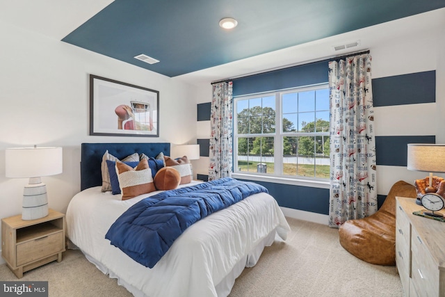 bedroom featuring carpet, visible vents, and baseboards