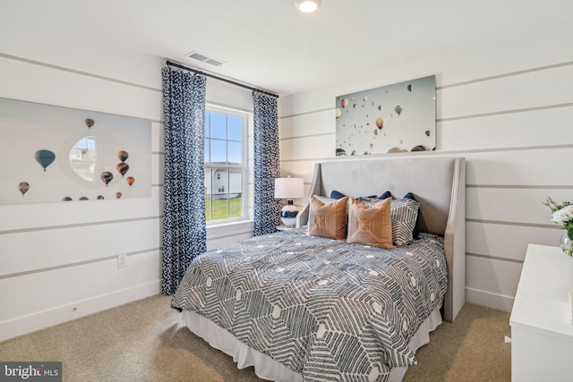 carpeted bedroom with visible vents