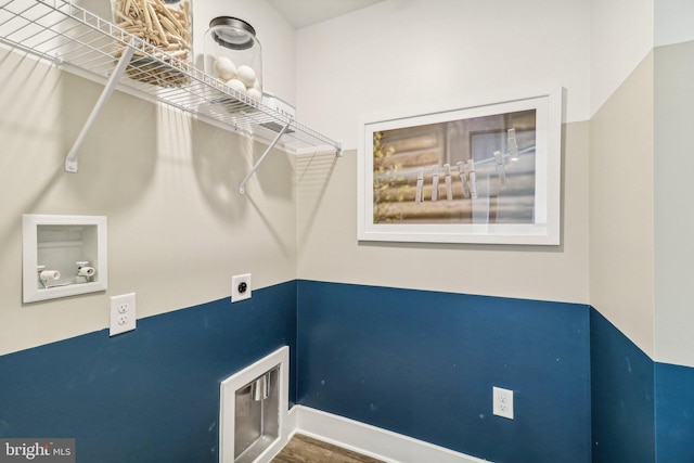 laundry area featuring laundry area, baseboards, electric dryer hookup, and wood finished floors