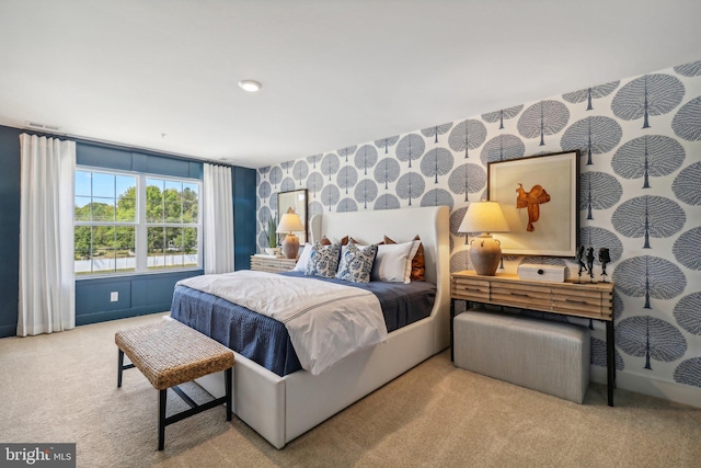 bedroom featuring carpet, visible vents, and wallpapered walls