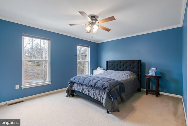 bedroom with visible vents, baseboards, ceiling fan, ornamental molding, and carpet