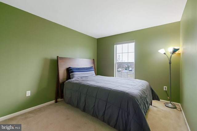 bedroom with carpet floors and baseboards