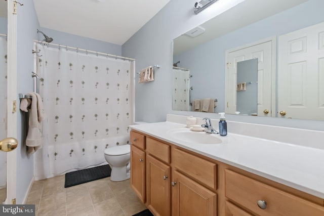 bathroom featuring vanity, tile patterned flooring, toilet, and a shower with curtain